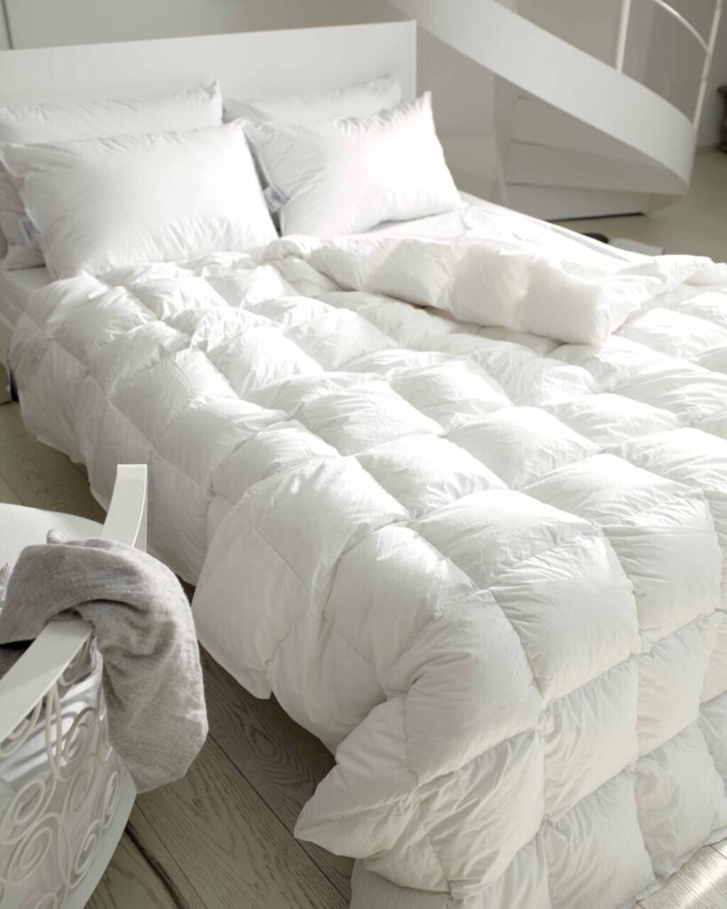 Vivere la felicità in casa grazie al caldo abbraccio di piumini, cuscini e topper